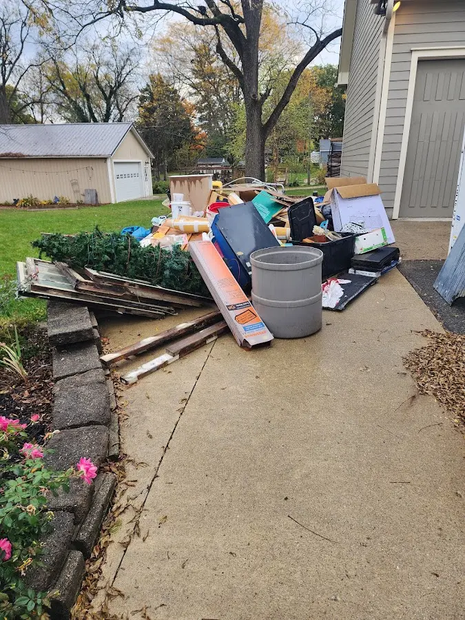 Dumpster being loaded with debris for Demolition Dumpster Rental in Crescent Springs